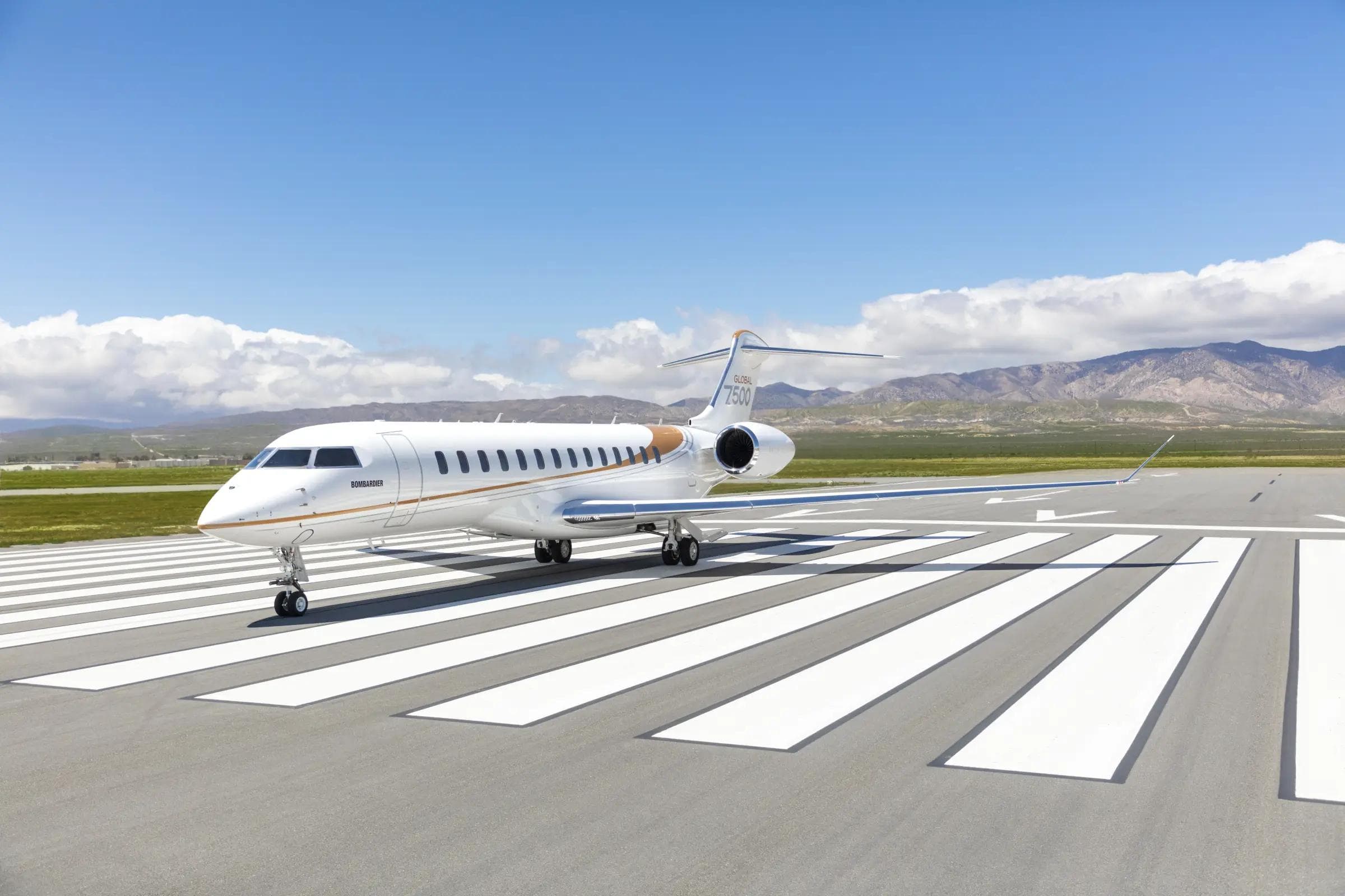 Bombardier Global 7500 ultra-long-range business jet exterior, three-quarter view on tarmac with main door open